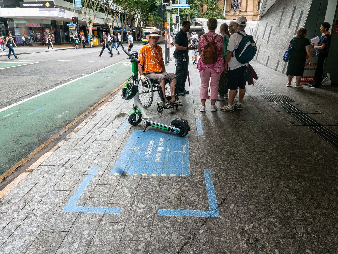 Shared Lime scooters parked in a marked zone in an Australian city