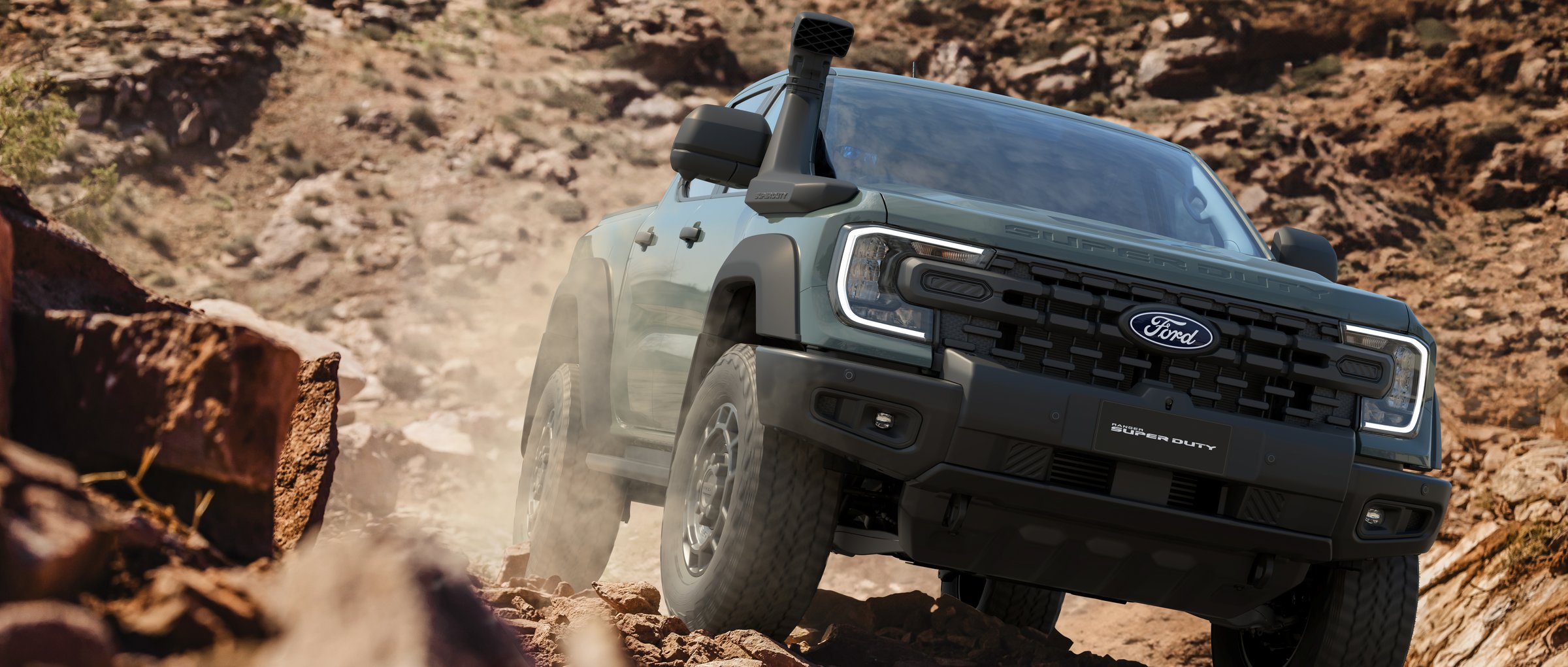 2026 Ford Ranger Super Duty towing a caravan off-road
